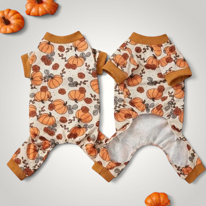 HappiFinds yellow pet onesie pajamas with a festive pumpkin print for dogs and cats, featuring soft ribbed cuffs.