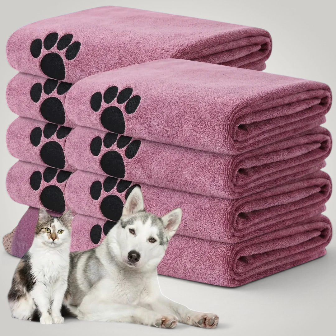 HappiFinds soft pink microfiber dog bath towels with black paw print patterns, stacked with a cat and husky dog.
