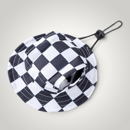 HappiFinds black and white checkered dog sun hat with an adjustable chin strap for outdoor pet sun protection