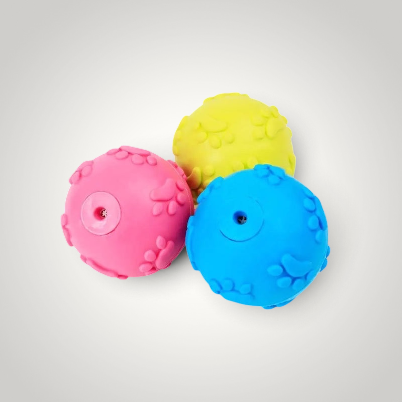 HappiFinds soft rubber chew balls for small dogs in bright pink, yellow, and blue with paw print textures.