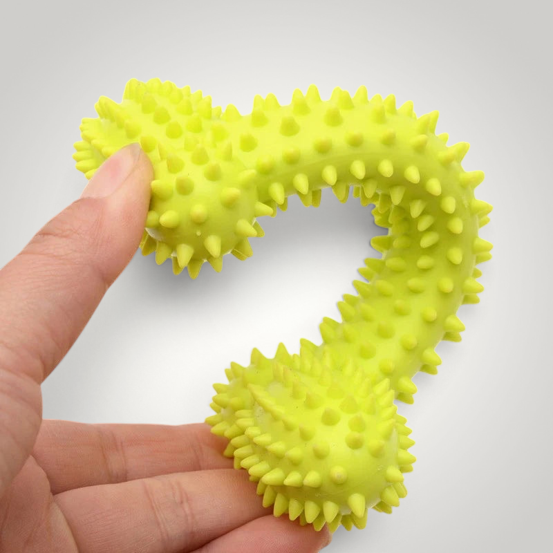 HappiFinds lime green soft rubber spiked dog chew toy held in hand for small dogs
