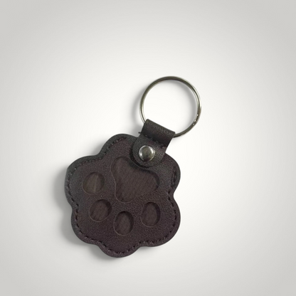 HappiFinds dark brown faux leather paw-print dog hair collector keychain with a sturdy metal ring.
