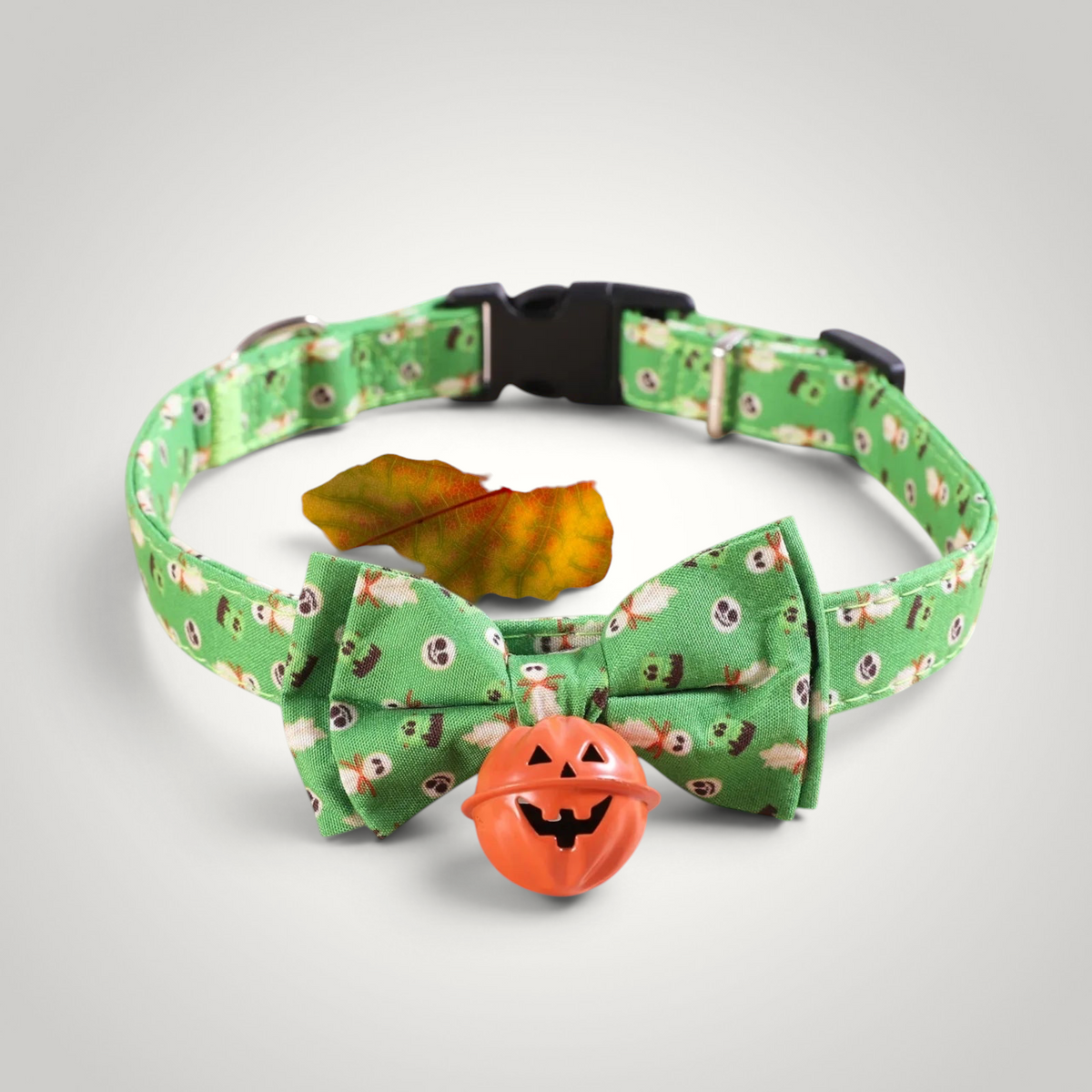 HappiFinds green Halloween cat collar with a bow tie and an orange pumpkin jingle bell charm