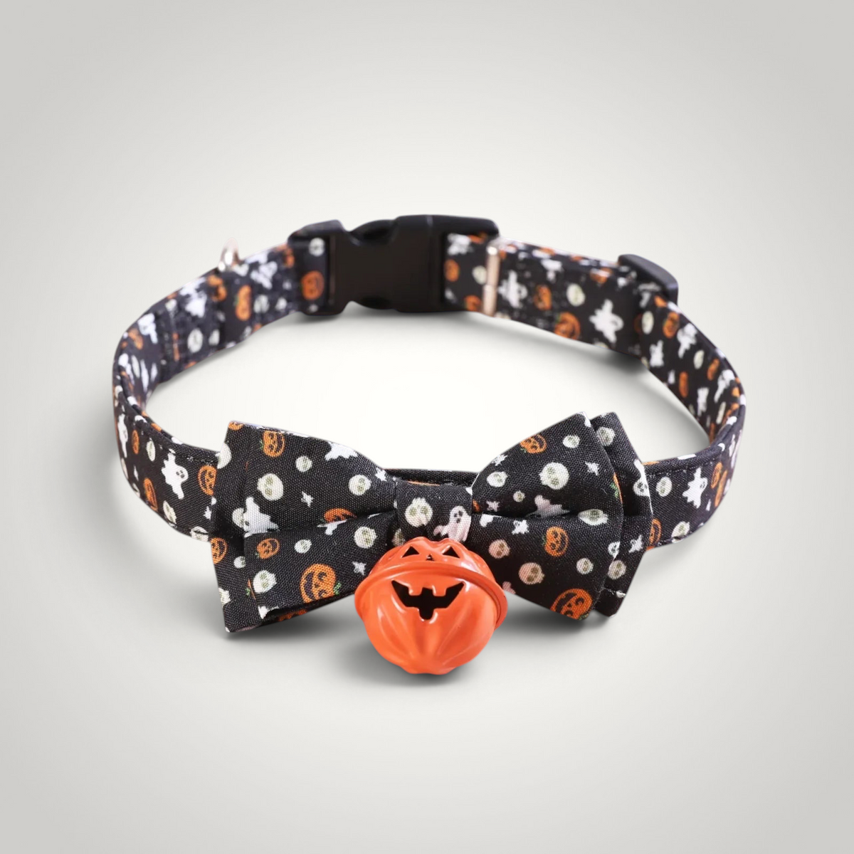 HappiFinds black Halloween cat collar with ghost and pumpkin print, bow tie, and orange pumpkin jingle bell charm.
