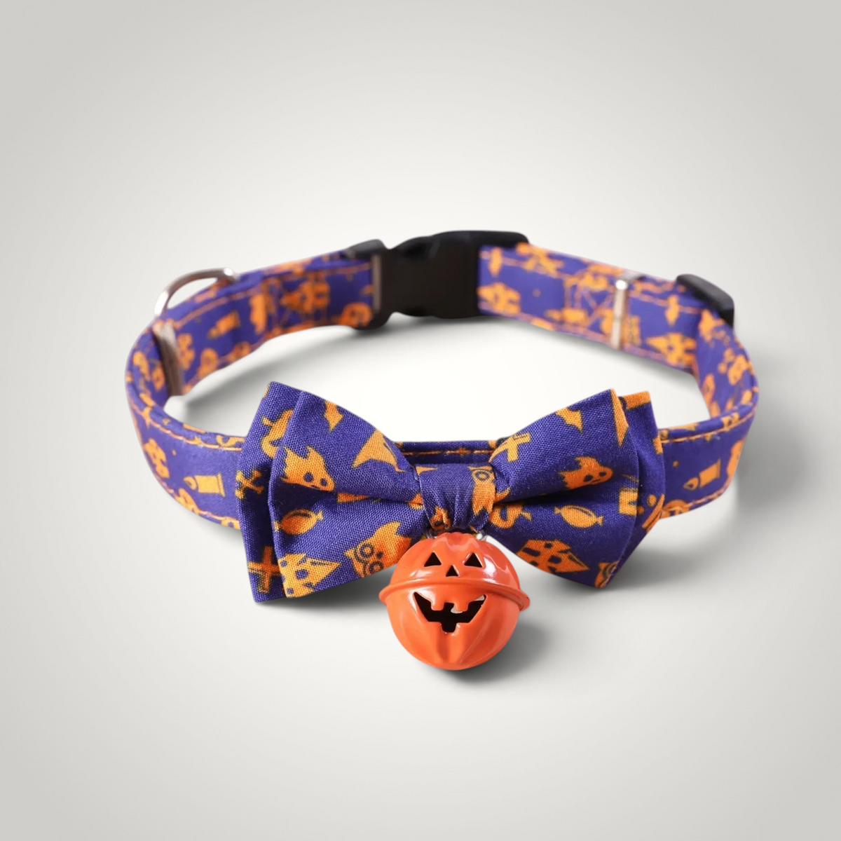 HappiFinds purple and orange Halloween cat collar with a bow tie and a pumpkin jingle bell charm.