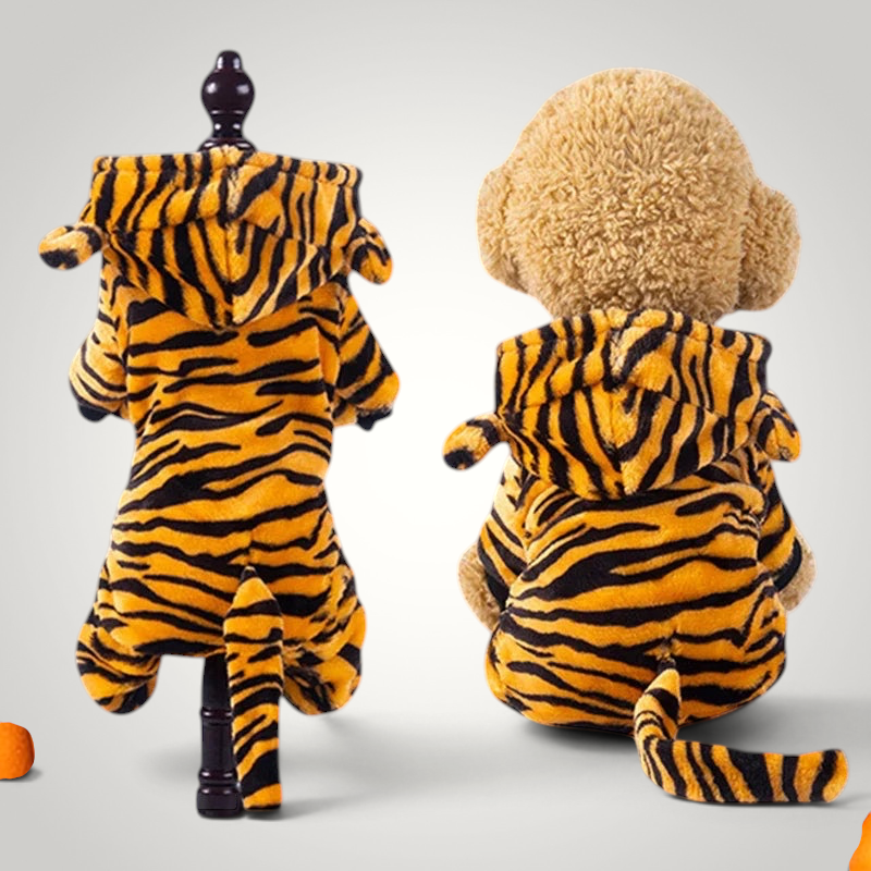 HappiFinds tiger-striped plush fleece dog jumpsuit with a hood and tail, shown on a mannequin and a stuffed animal.