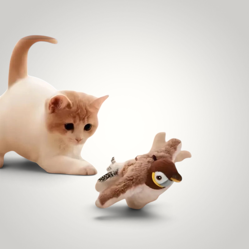 HappiFinds brown plush bird cat toy that chirps and flaps, being pounced on by a cute ginger and white cat.